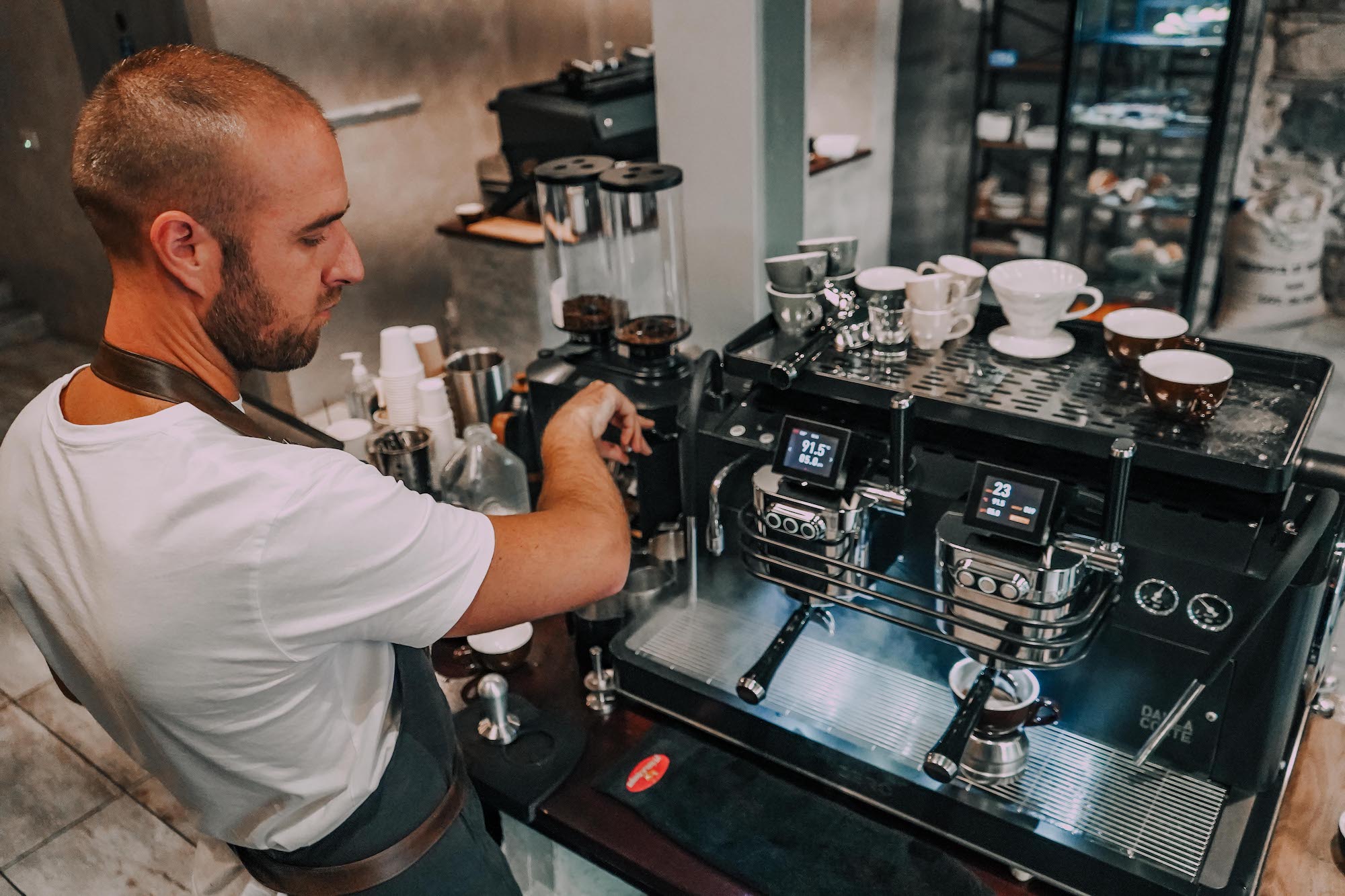 A barista pulls an espresso shot.