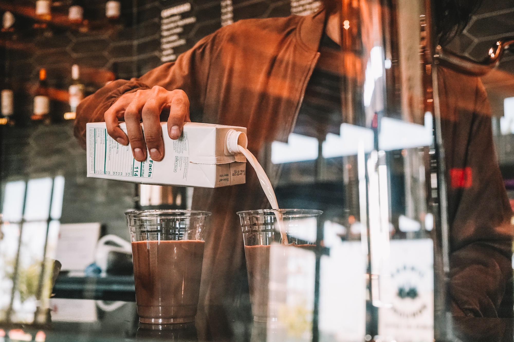 A barista makes iced coffee.