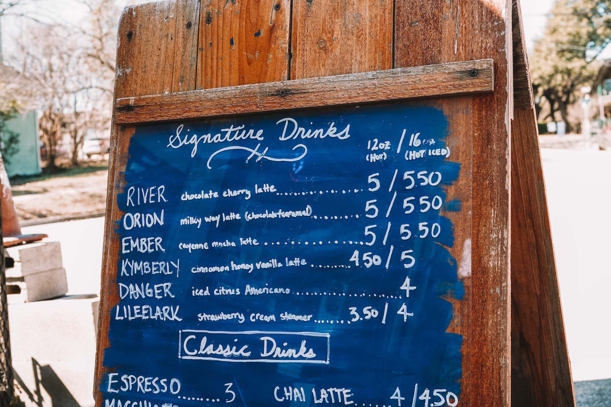 A menu shows specialty drinks.