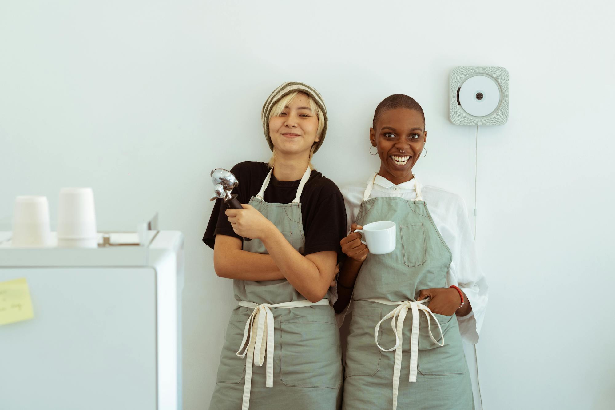 Two baristas at a coffee shop.