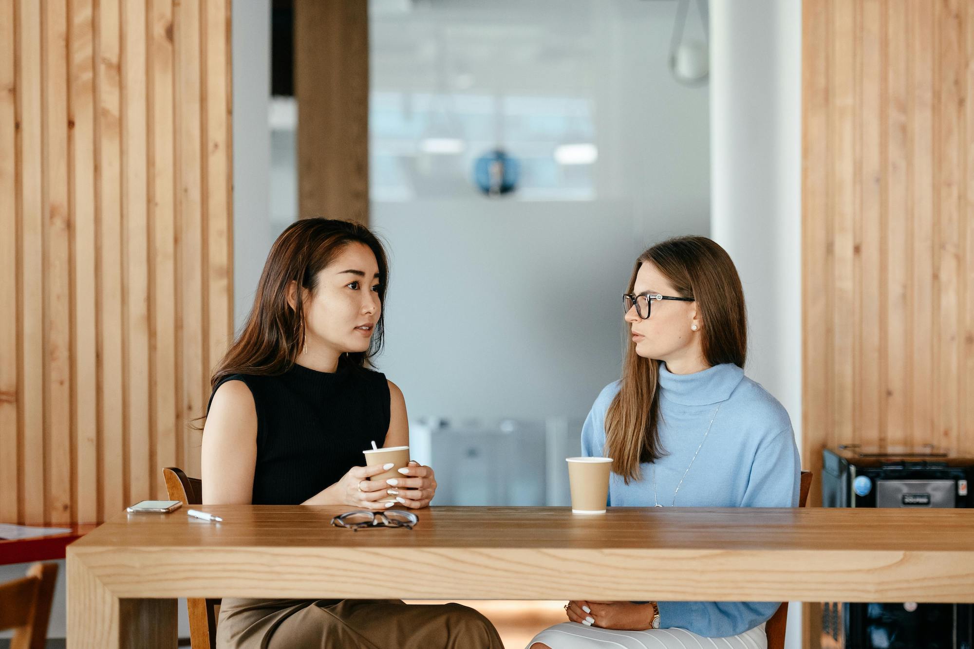 A manager and barista discuss performance.