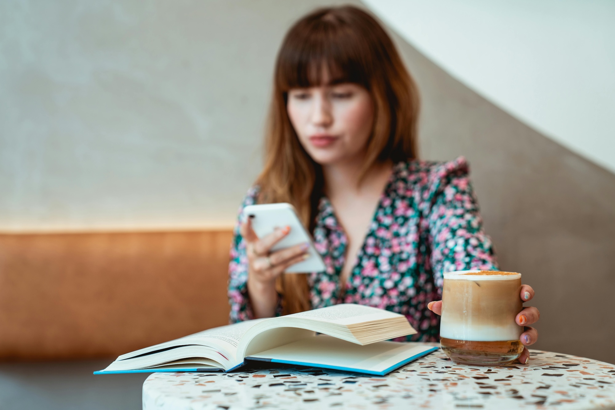 A woman drinks specialty coffee.