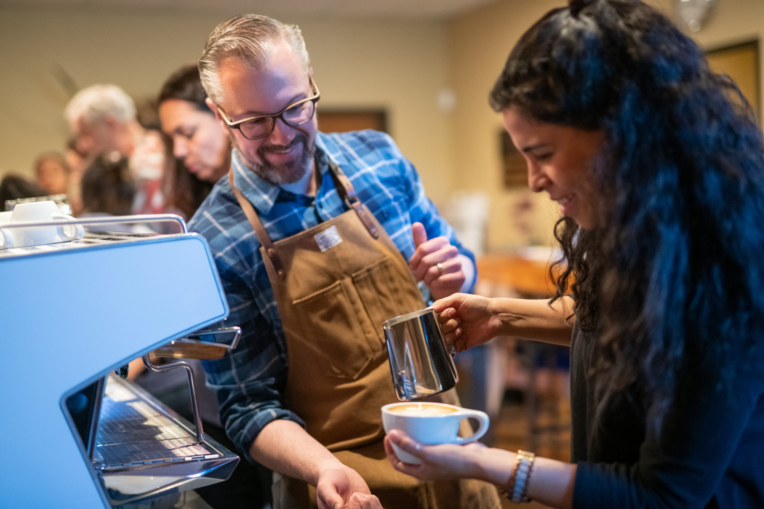 Texas Coffee School CEO teaches a student in class.