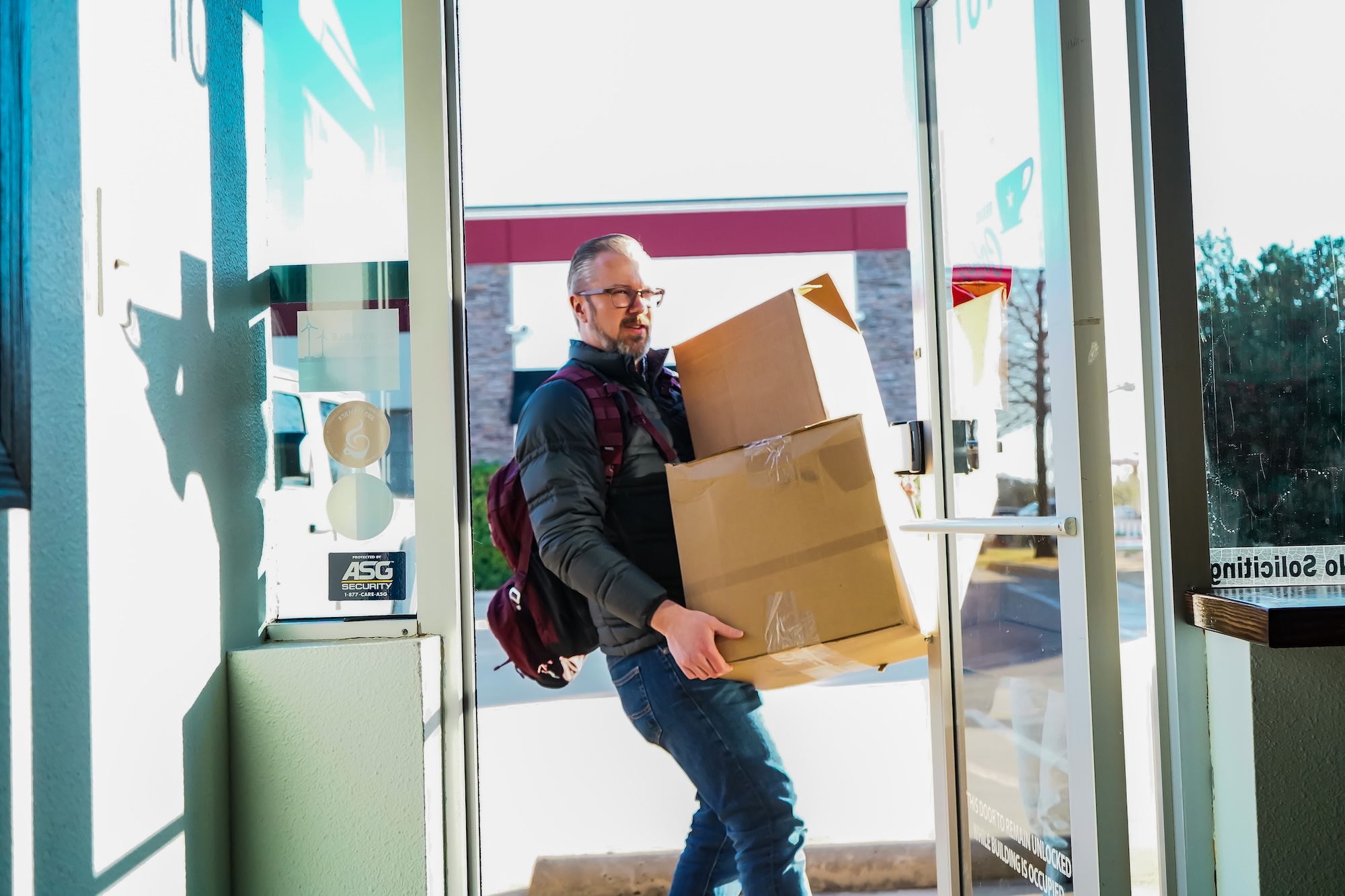 Tom Vincent carries boxes.