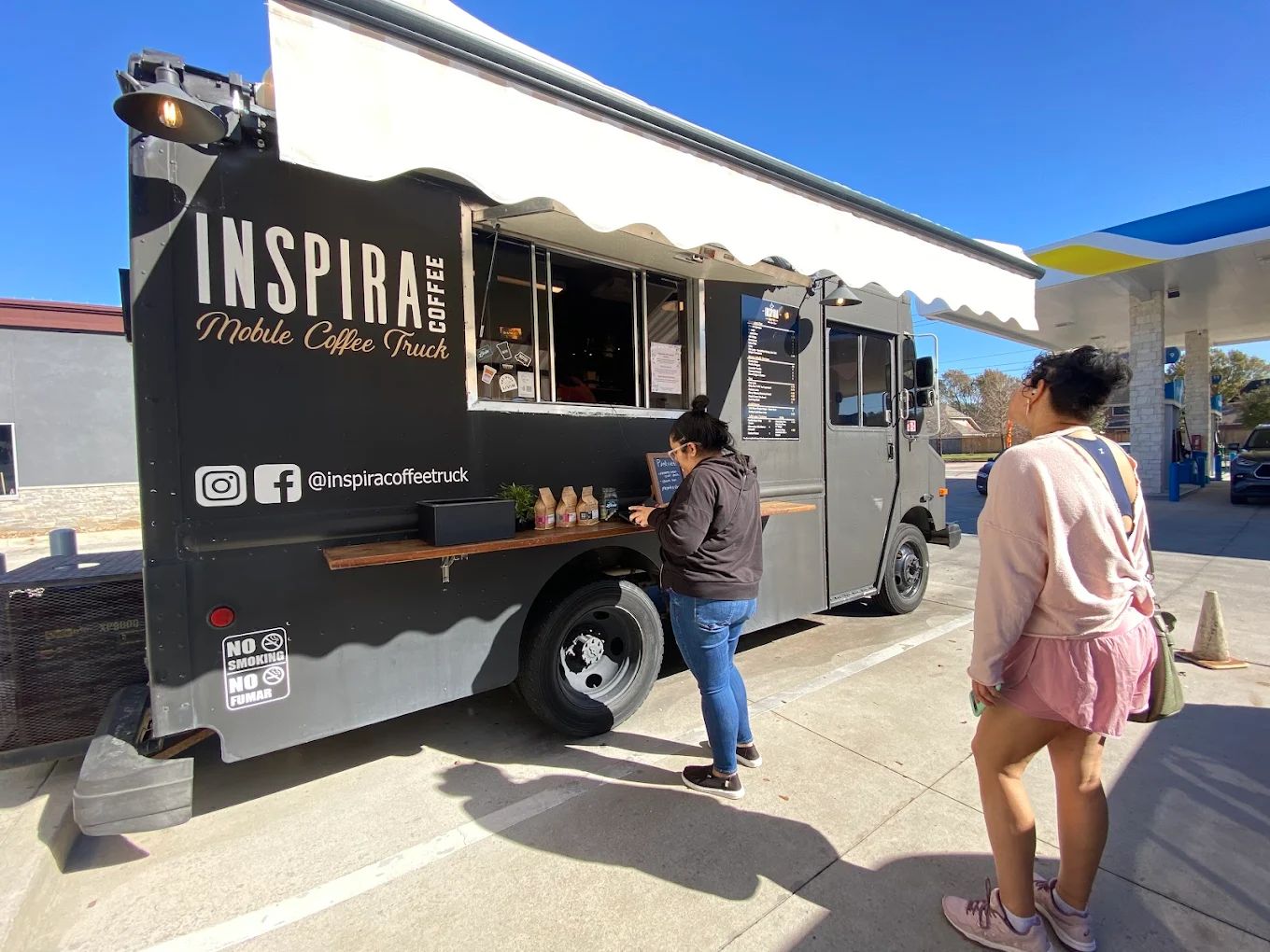 Customers order from Inspira Coffee.