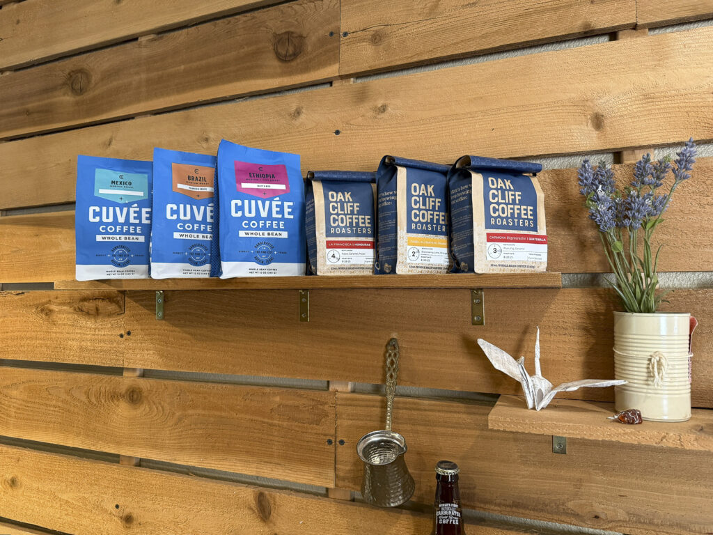 Bags of specialty coffee neatly organized on a shelf