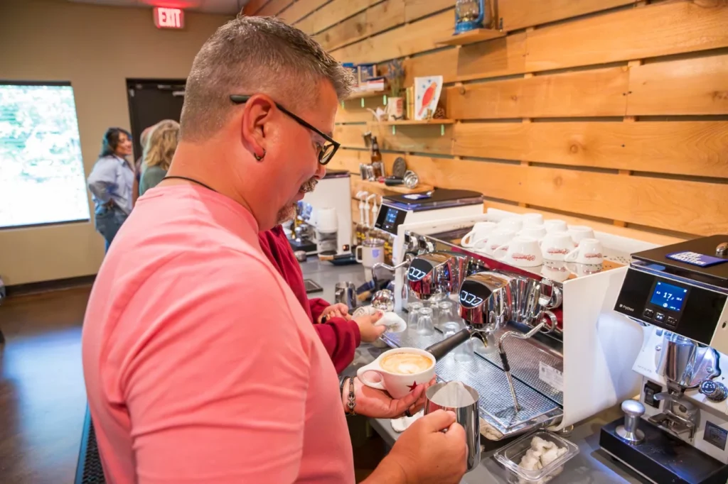 Man making latte at Texas Coffee School's 3-Day Coffee Business Education Course.
